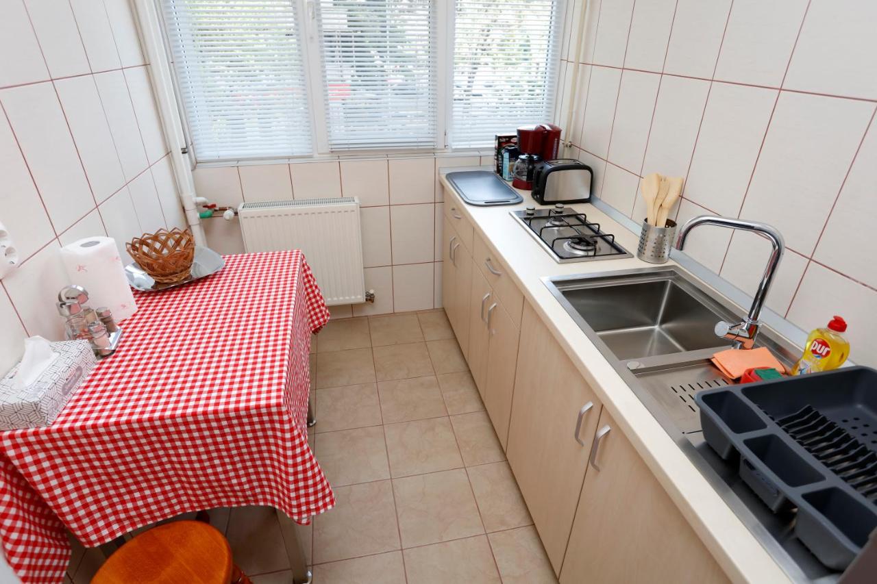 The kitchen table, with a red checked tablecloth